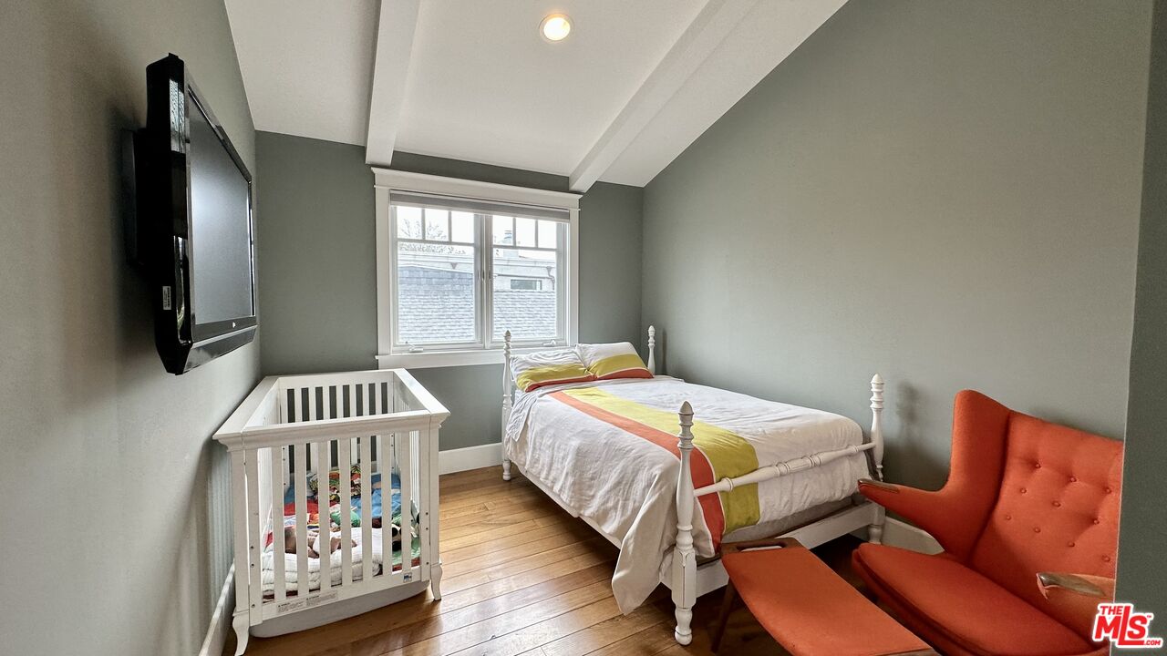 910 Marco Place Venice, CA 90291 - Photo 31 of 43 a bedroom with furniture and a flat screen tv