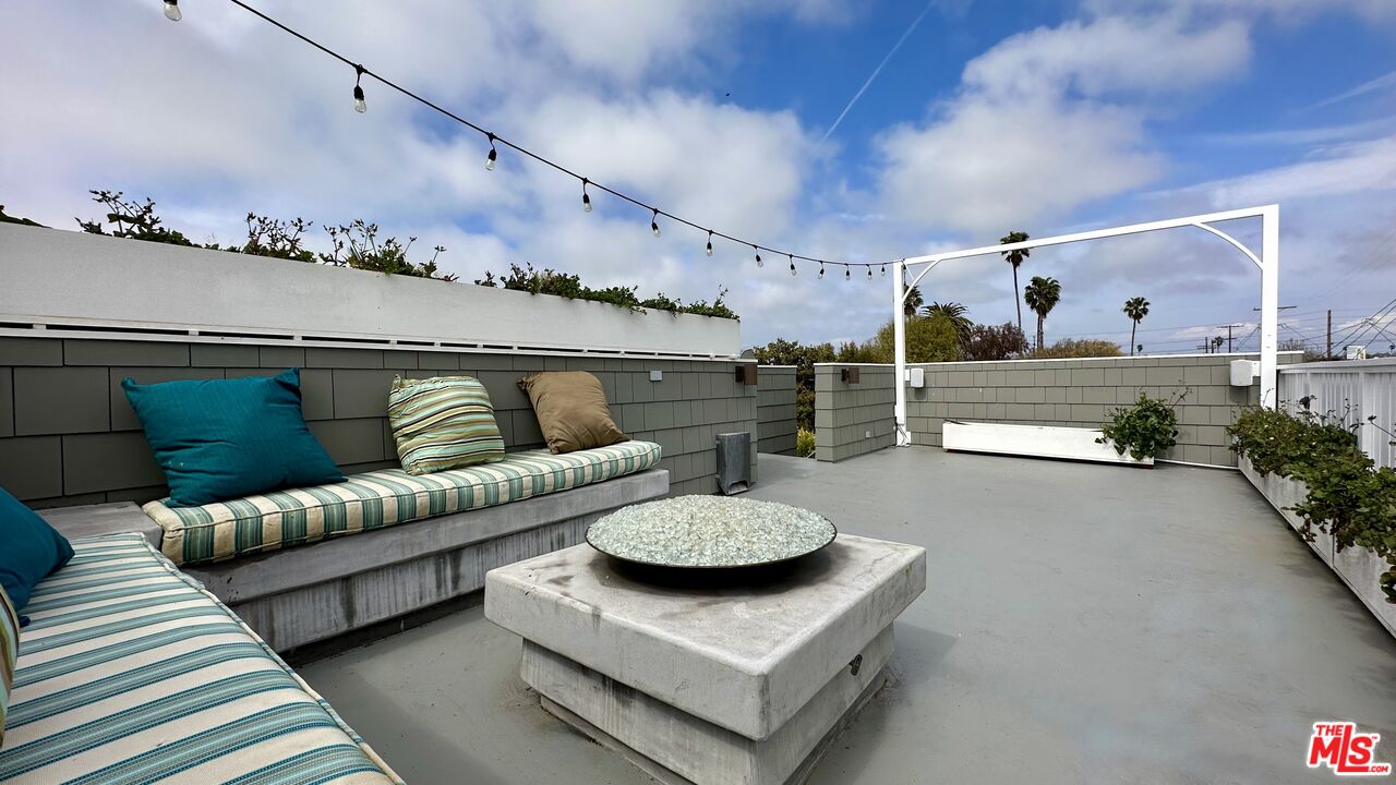 910 Marco Place Venice, CA 90291 - Photo 36 of 43 a living room with furniture and a potted plant