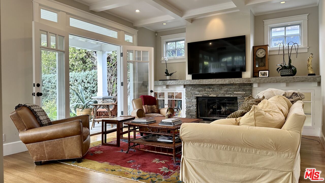 910 Marco Place Venice, CA 90291 - Photo 5 of 43 a living room with furniture a flat screen tv and a fireplace
