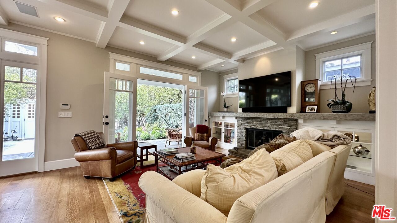 910 Marco Place Venice, CA 90291 - Photo 6 of 43 a living room with furniture fireplace and a flat screen tv