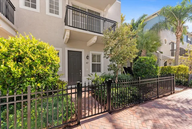 a view of a house with a flower garden