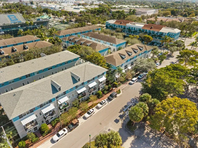 an aerial view of residential building and lake