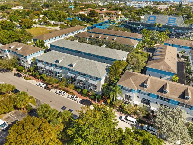 an aerial view of residential houses with outdoor space