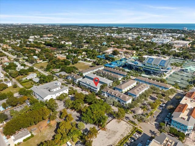 an aerial view of residential building with parking