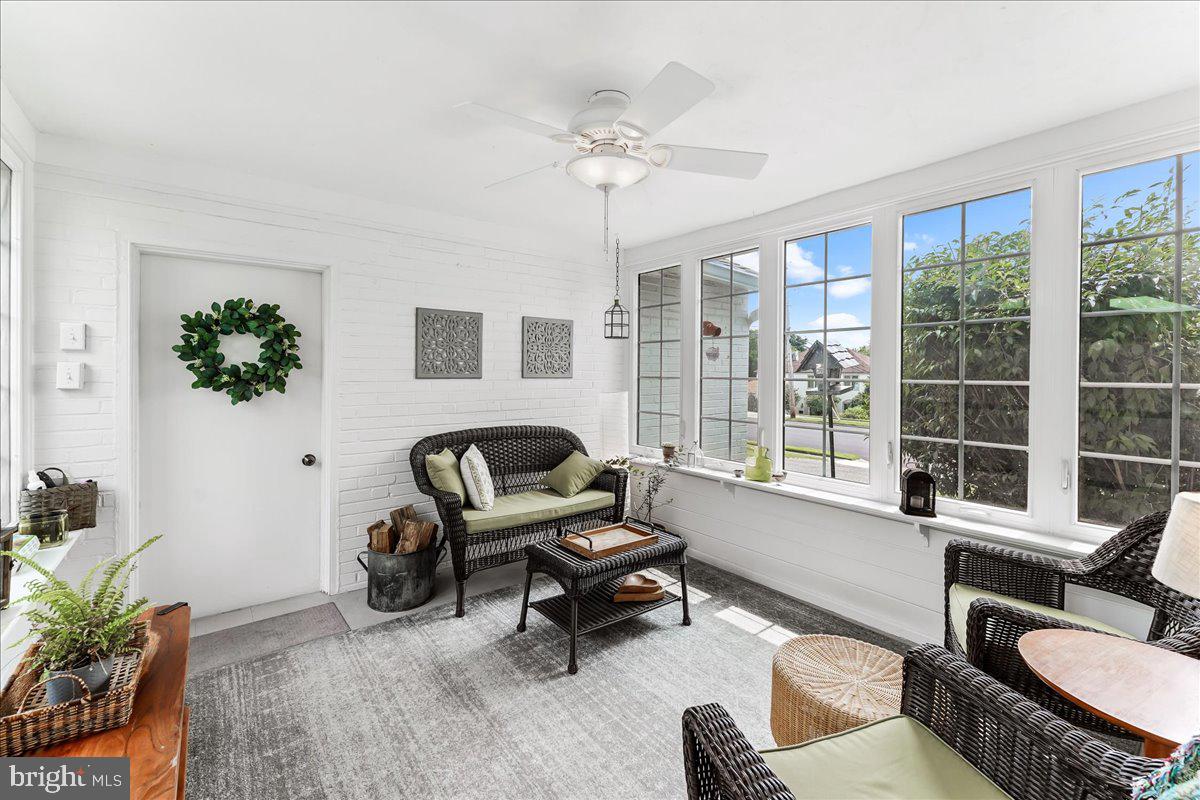 400 Southcroft Road Springfield, PA 19064 - Photo 17 of 44 a living room with furniture a chandelier and a window
