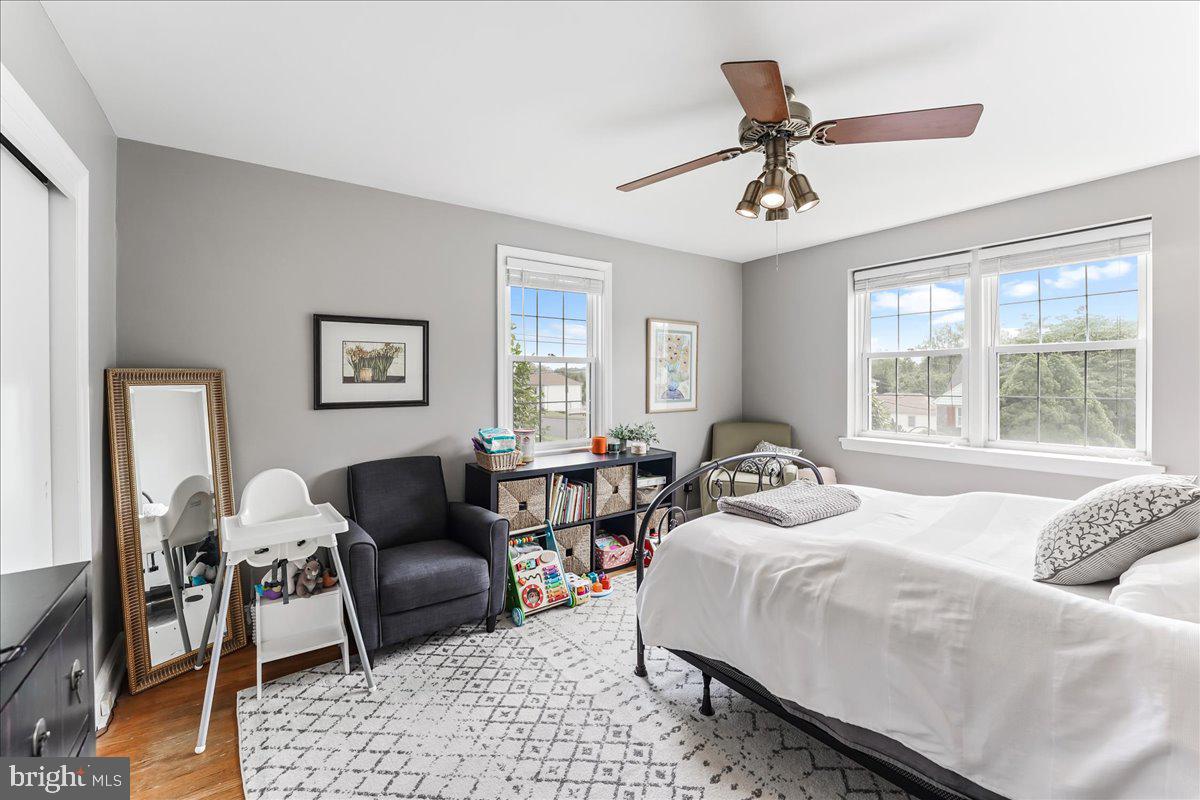 400 Southcroft Road Springfield, PA 19064 - Photo 20 of 44 a bedroom with a bed a couch and window