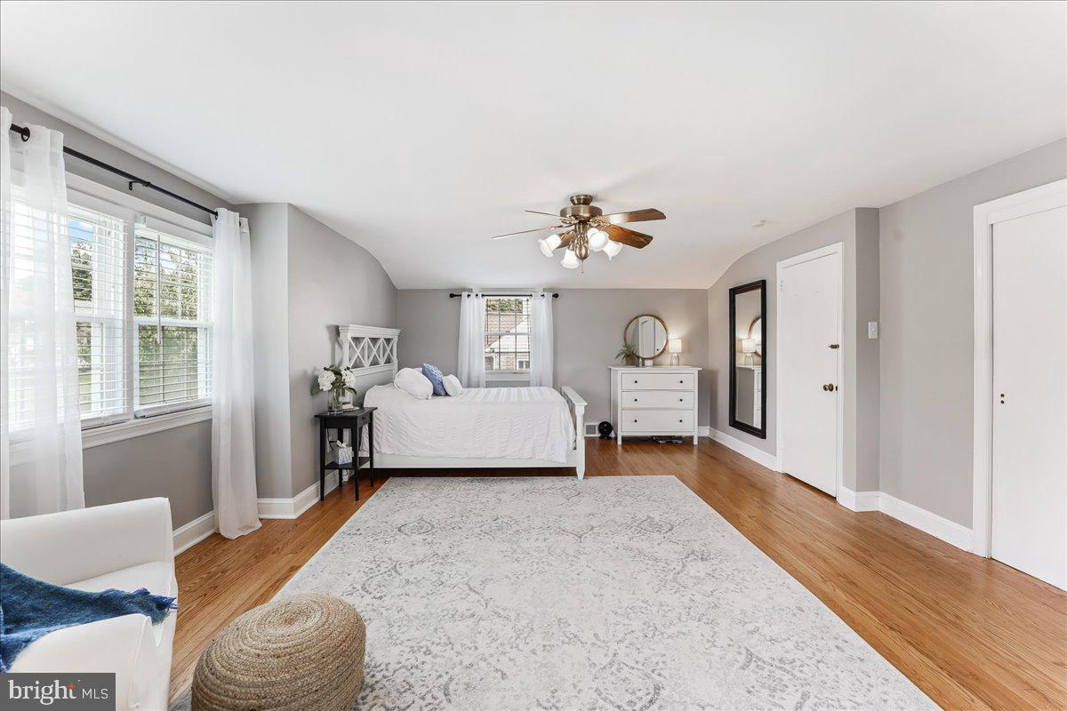 400 Southcroft Road Springfield, PA 19064 - Photo 23 of 44 a spacious bedroom with a bed and a large window