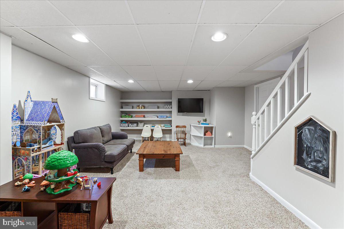 400 Southcroft Road Springfield, PA 19064 - Photo 28 of 44 a living room with furniture and a flat screen tv