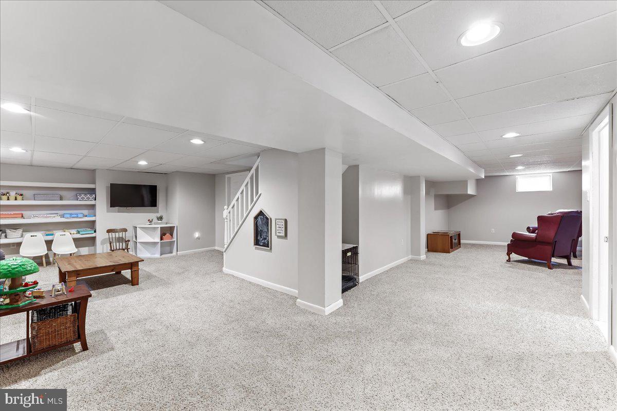 400 Southcroft Road Springfield, PA 19064 - Photo 29 of 44 a living room with furniture and a large window