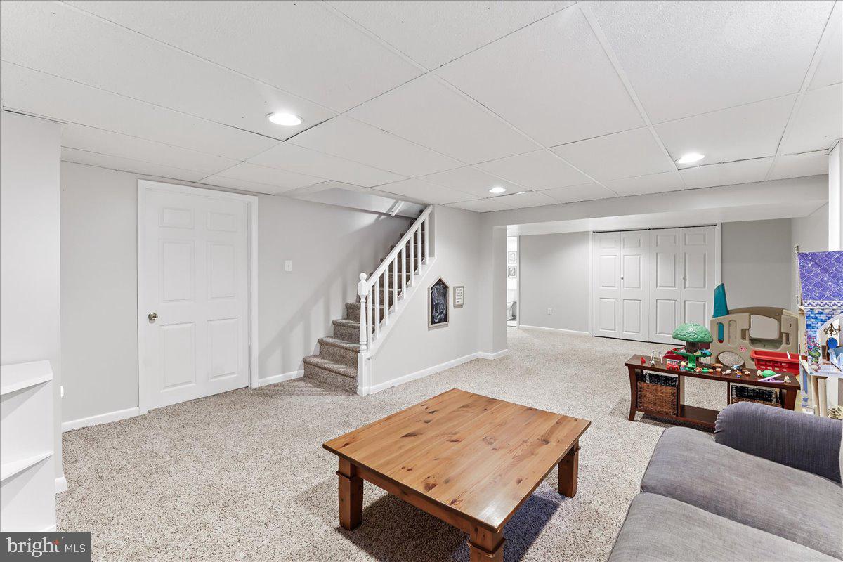 400 Southcroft Road Springfield, PA 19064 - Photo 30 of 44 a living room with furniture and a wooden floor