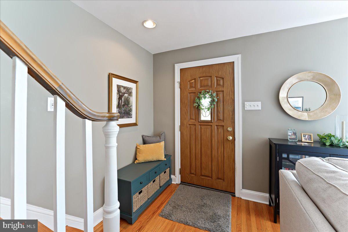 400 Southcroft Road Springfield, PA 19064 - Photo 3 of 44 a bedroom with bed and a chandelier