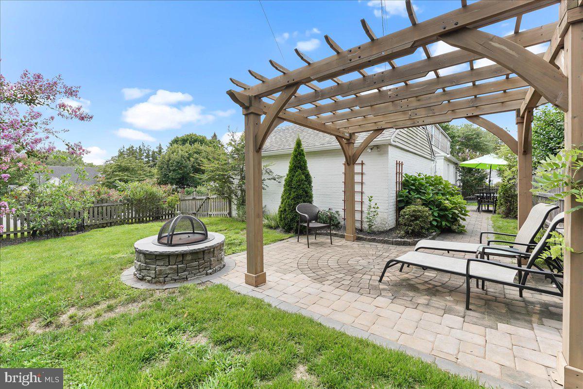 400 Southcroft Road Springfield, PA 19064 - Photo 34 of 44 a view of a chair and table in backyard of the house