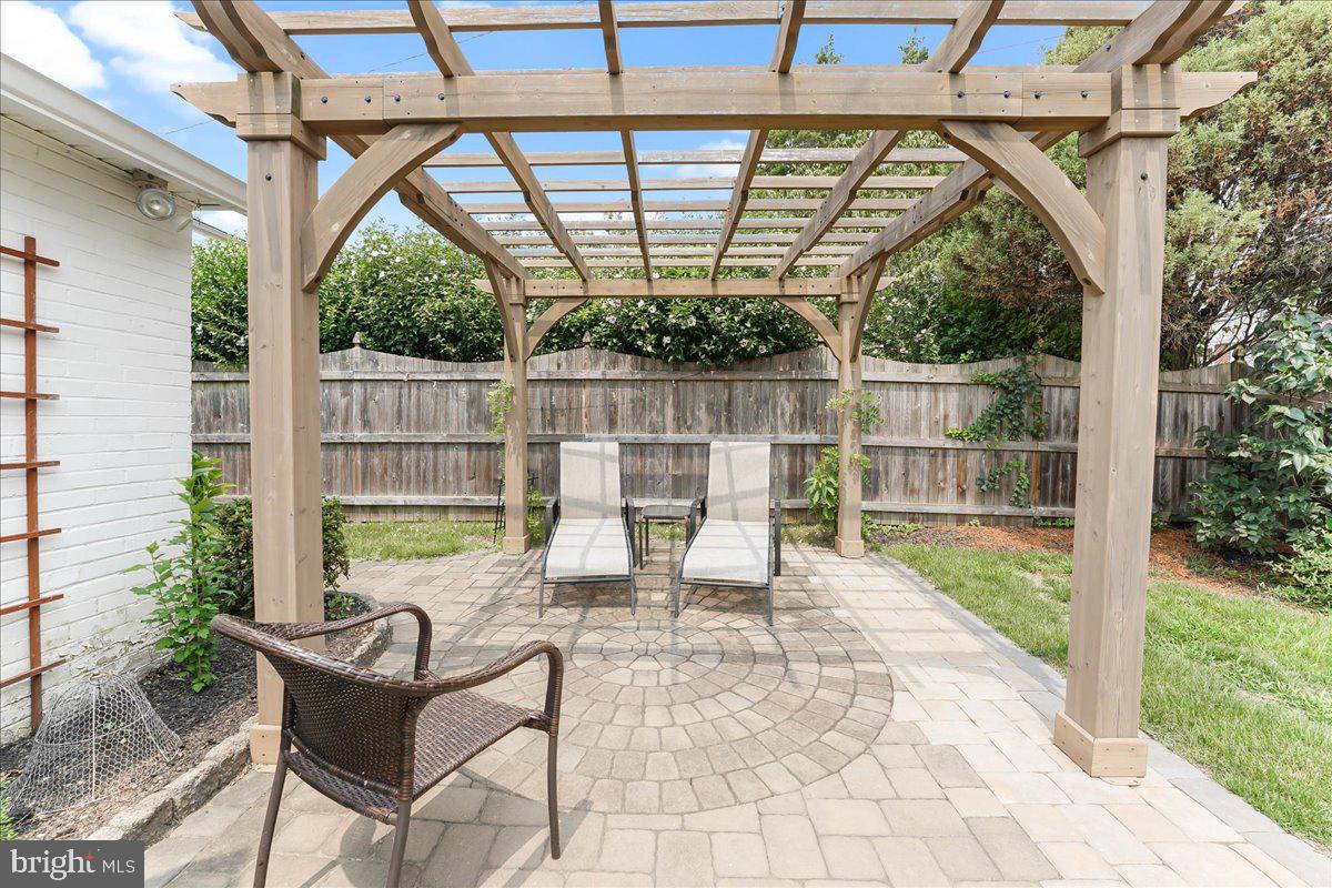 400 Southcroft Road Springfield, PA 19064 - Photo 36 of 44 a view of a chair and tables in the patio next to a yard