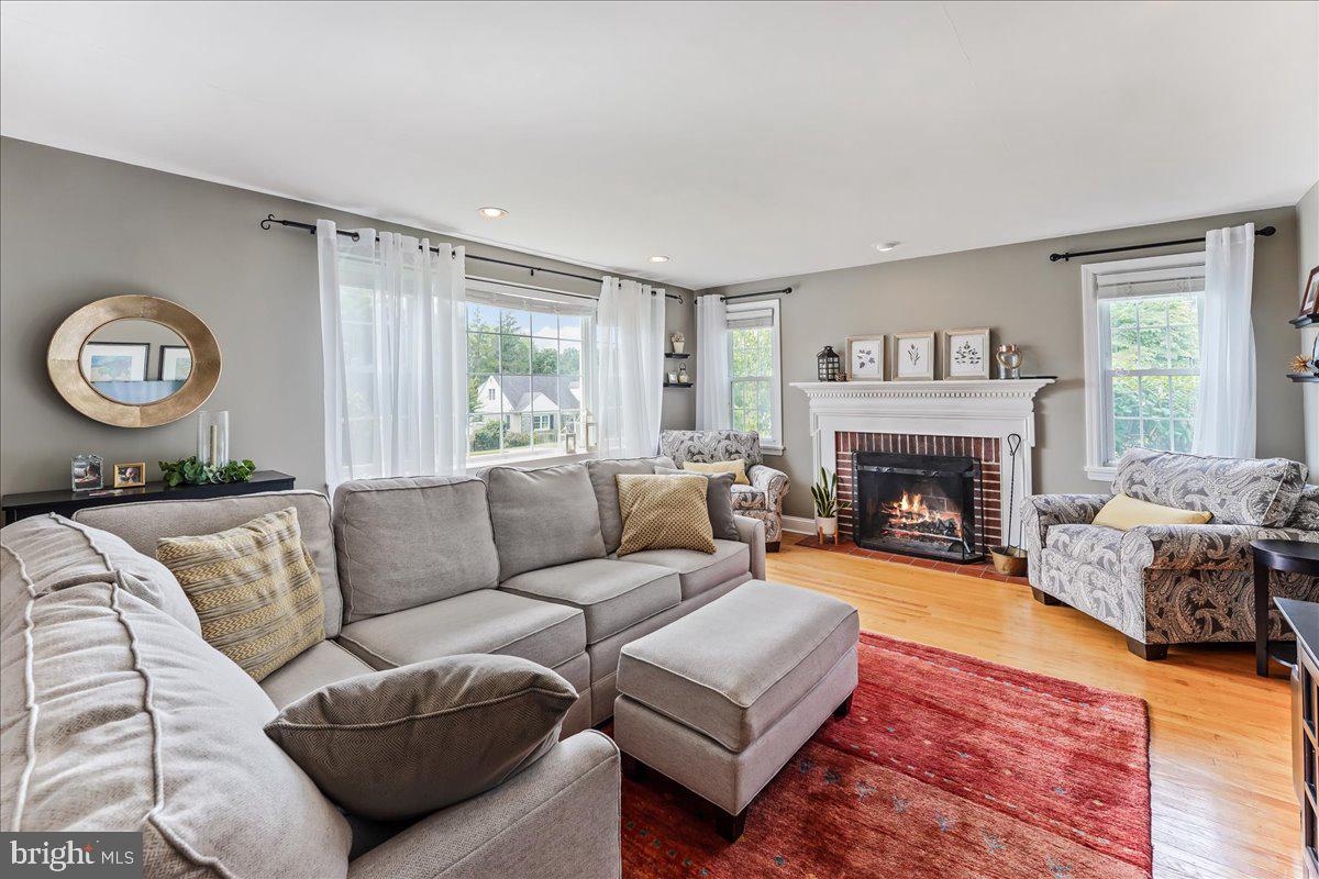 400 Southcroft Road Springfield, PA 19064 - Photo 6 of 44 a living room with furniture and a fireplace