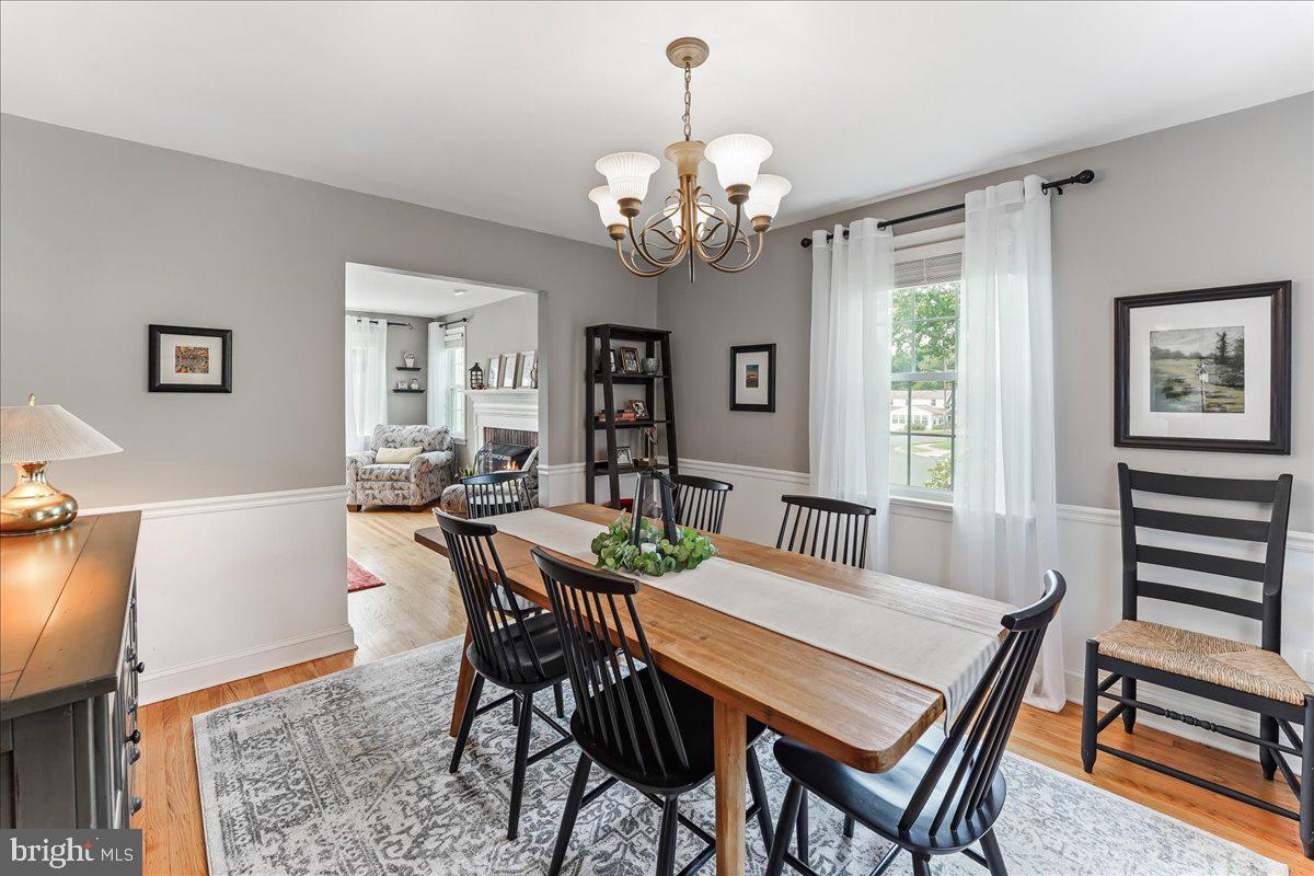 400 Southcroft Road Springfield, PA 19064 - Photo 9 of 44 a view of a dining room with furniture and a chandelier