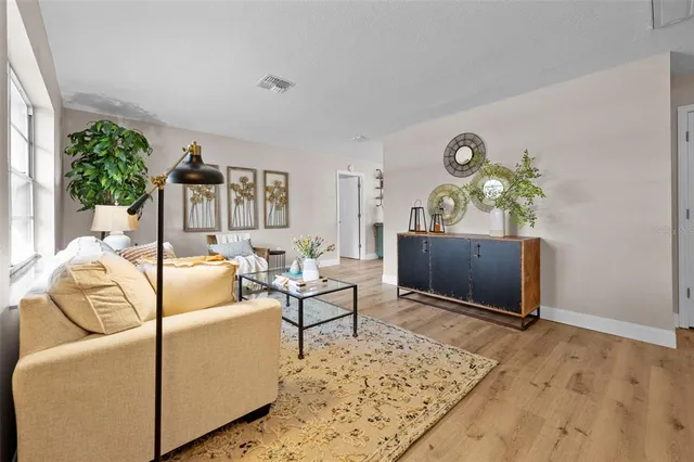 a living room with furniture and a clock