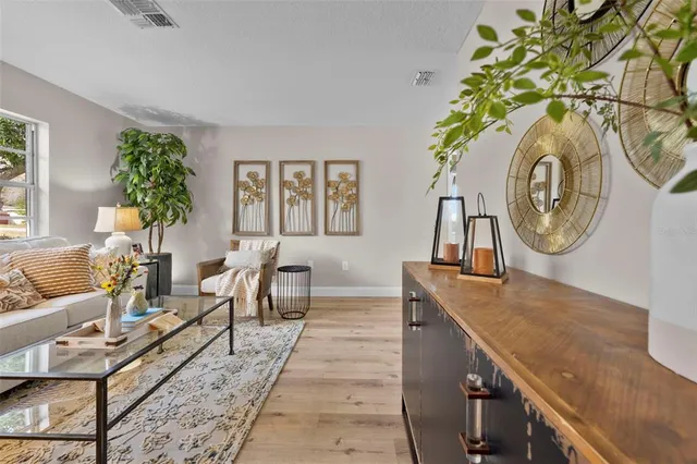 a living room with furniture and a large window