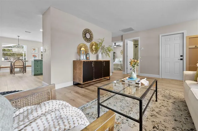 a living room with furniture and a large window