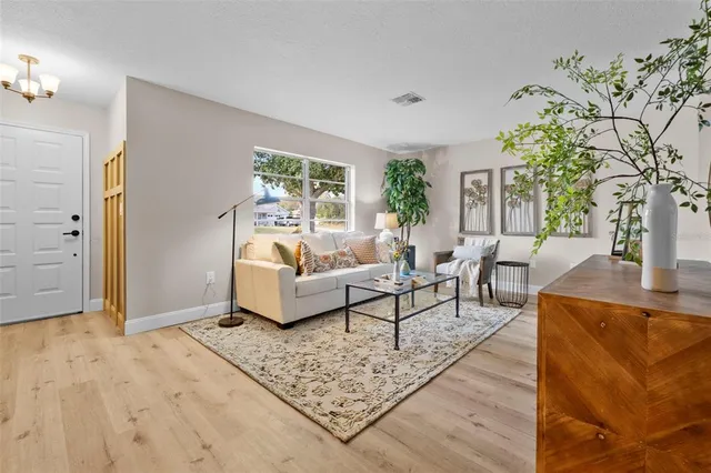 a living room with furniture and a large window