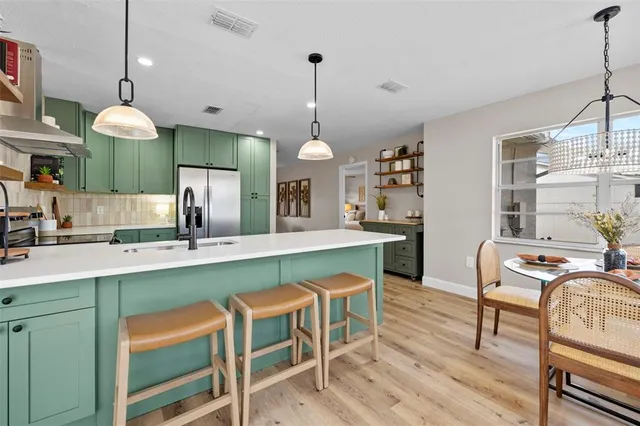 a bedroom with a bed and painting on the wall