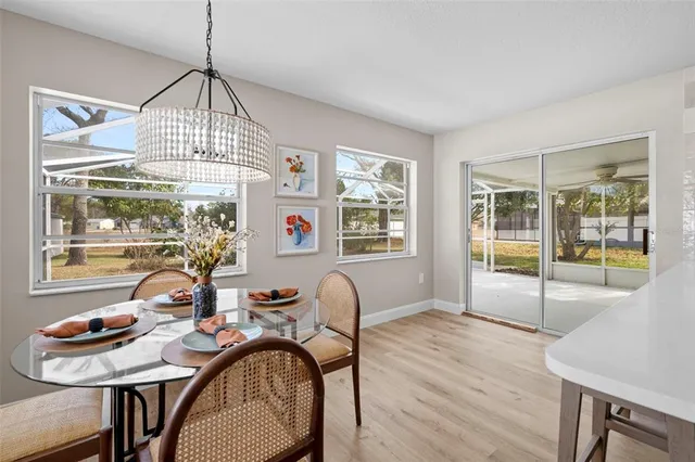 a view of an empty room with a fireplace and a large window
