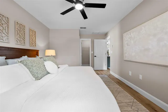 a front view of house with yard and trees around