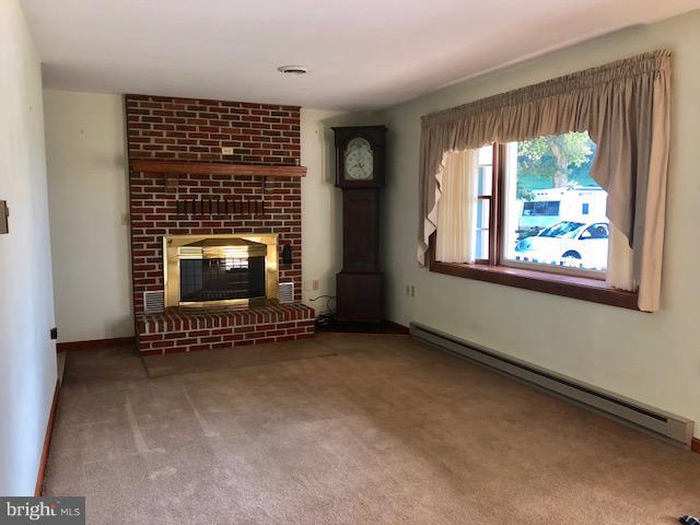 179 Stullfield Road Chambersburg, PA 17202 - Photo 2 of 21 Living Room with fireplace and heatalator