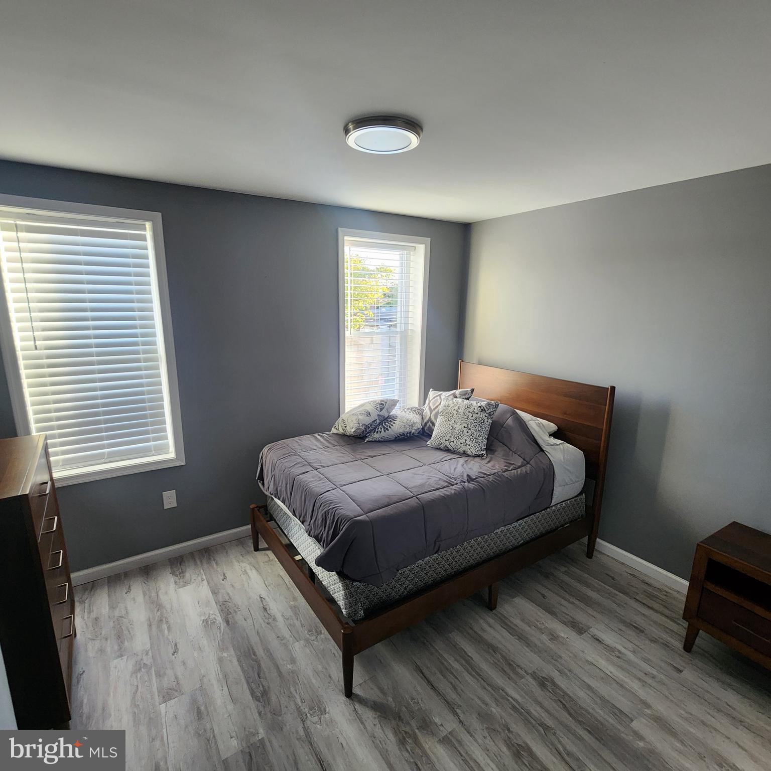 1926 East 28th Street Baltimore, MD 21218 - Photo 13 of 19 a bedroom with a bed and window