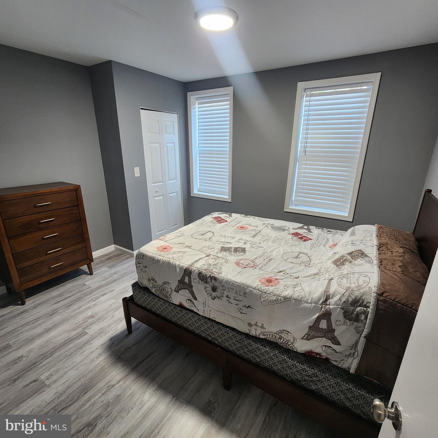 1926 East 28th Street Baltimore, MD 21218 - Photo 9 of 19 a bedroom with a bed and a dresser