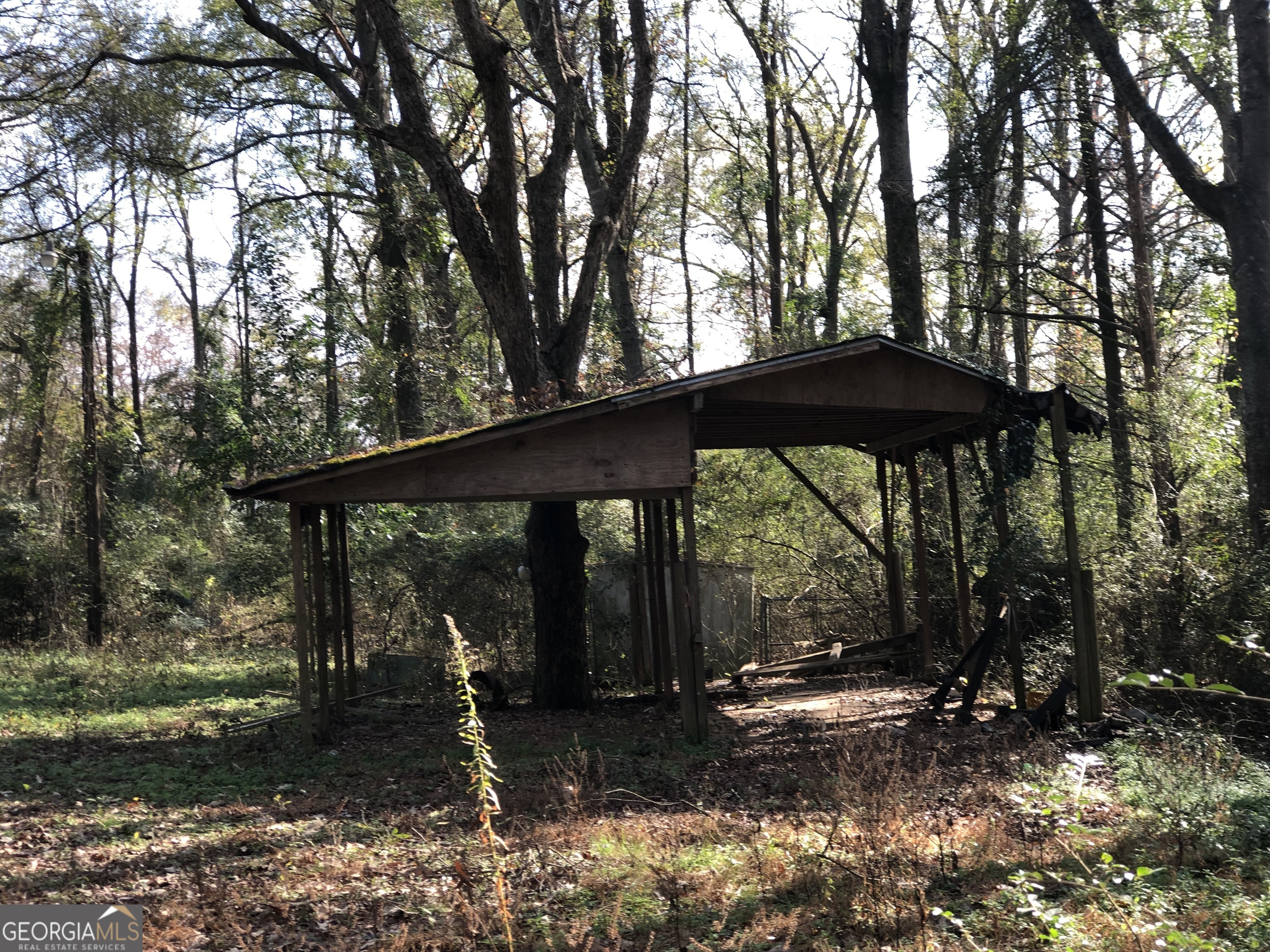 216 East Moores Crossing Road Thomaston, GA 30286 - Photo 6 of 6 a backyard of a house with barbeque oven