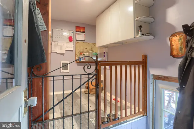 a bathroom with a sink and mirror with bathtub