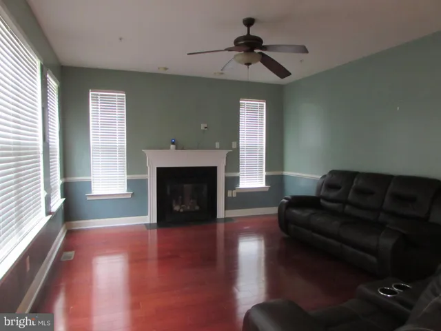 a bathroom with a granite countertop sink a large mirror and vanity