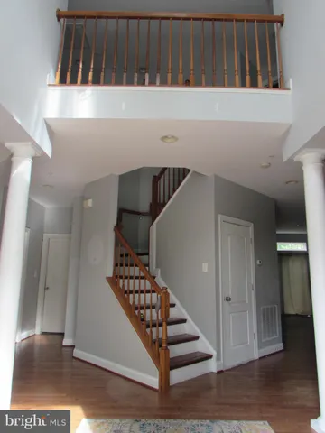 a view of entryway with wooden floor