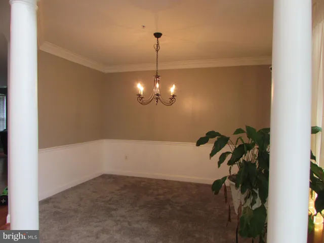 a view of room with window and furniture