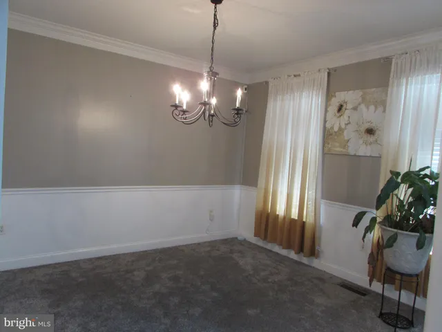 a kitchen with a sink a stove a refrigerator and cabinets