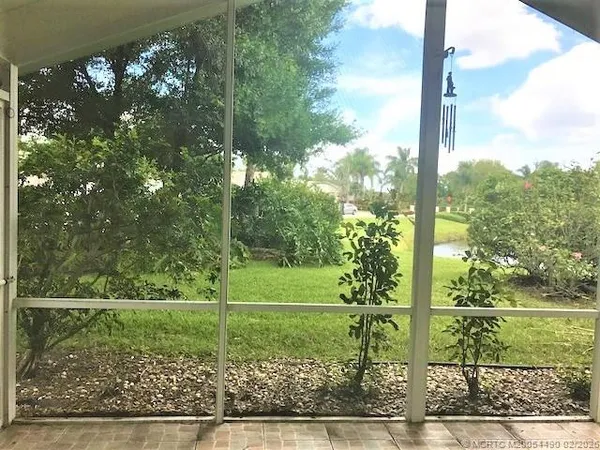 a view of a park with large windows