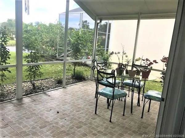 a view of an outdoor space with furniture and city view