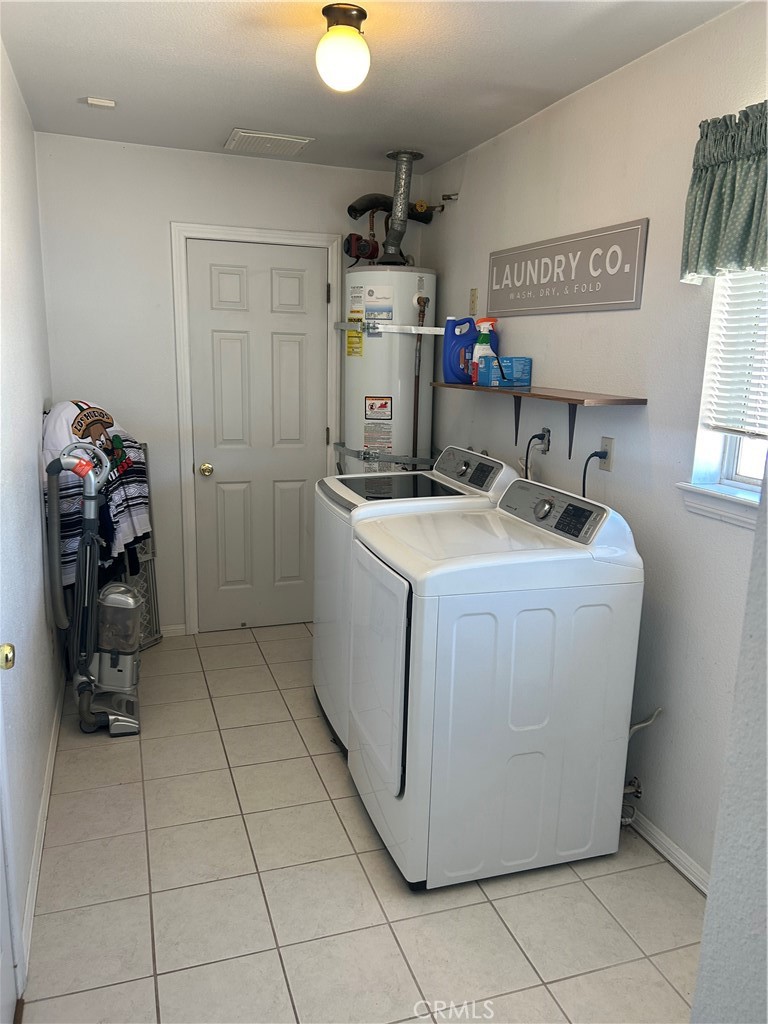 20187 Itasca Road Apple Valley, CA 92308 - Photo 24 of 35 a utility room with a sink washer and dryer