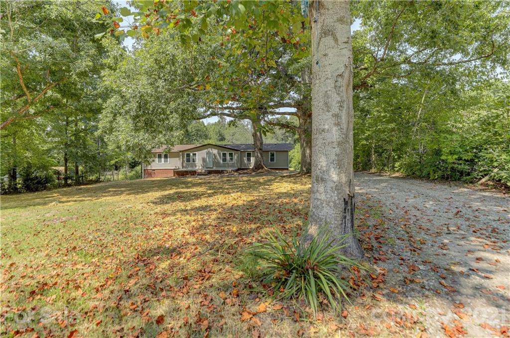 179 Davidson Road Clover, SC 29710 - Photo 2 of 31 a view of a yard with trees