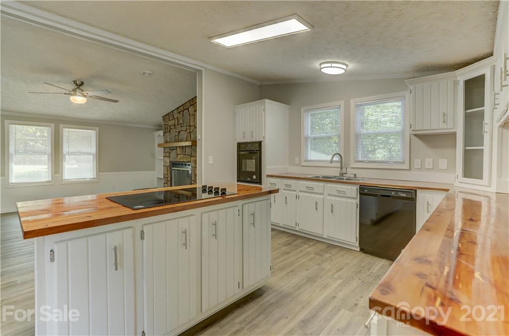 179 Davidson Road Clover, SC 29710 - Photo 13 of 31 a kitchen with granite countertop a sink stainless steel appliances and cabinets
