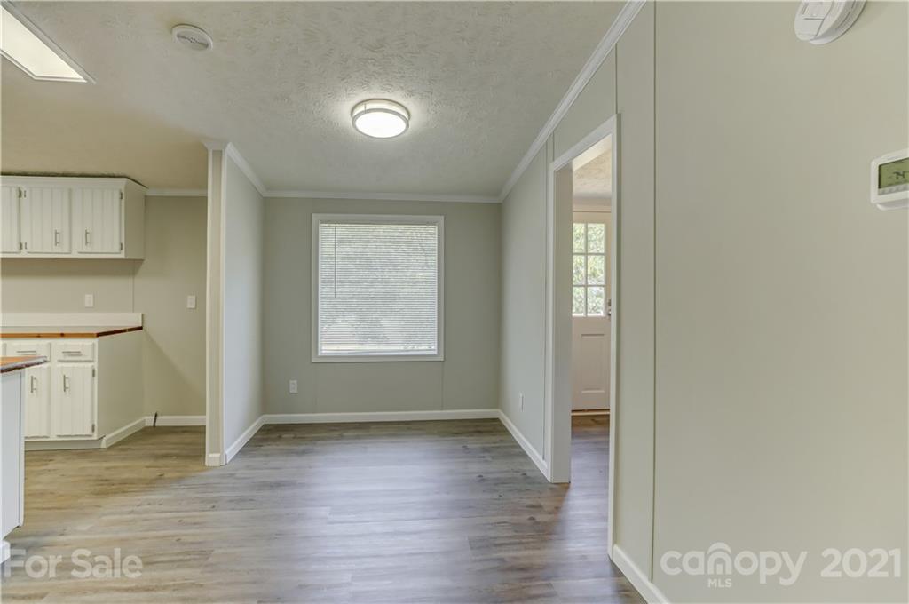 179 Davidson Road Clover, SC 29710 - Photo 14 of 31 a view of an empty room with wooden floor and a window
