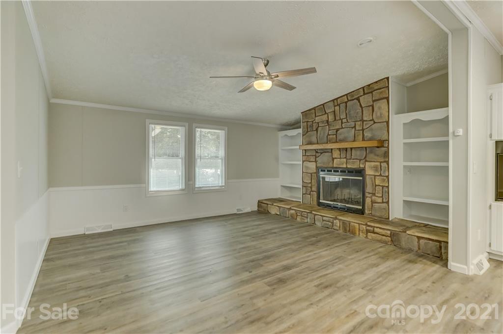 179 Davidson Road Clover, SC 29710 - Photo 15 of 31 an empty room with windows fireplace and a sink