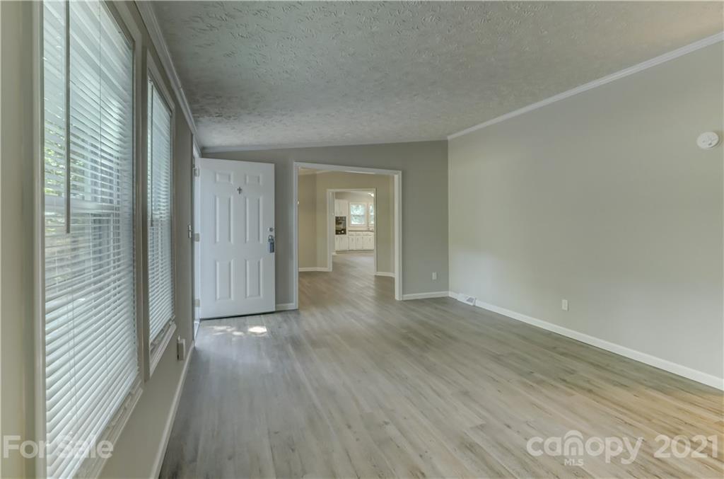 179 Davidson Road Clover, SC 29710 - Photo 7 of 31 a view of a hallway with wooden floor and closet