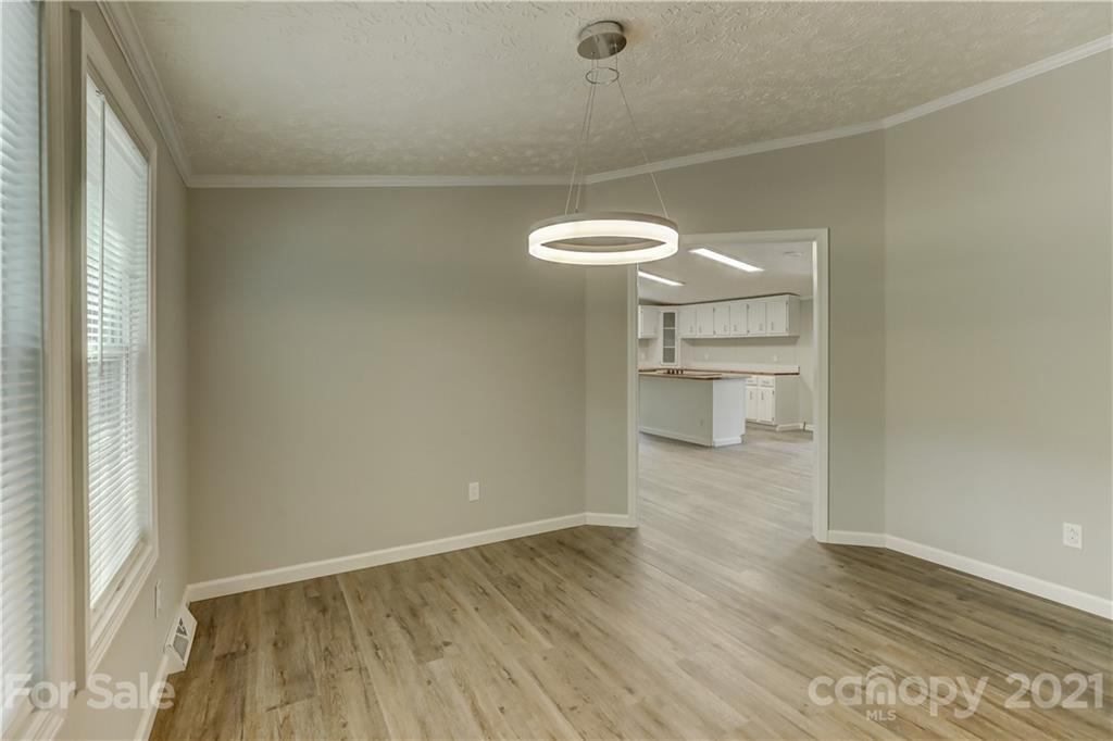 179 Davidson Road Clover, SC 29710 - Photo 9 of 31 a view of a room with wooden floor and white walls