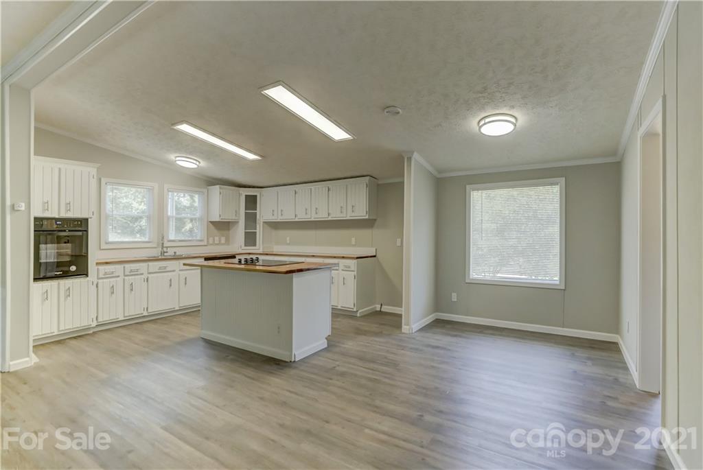 179 Davidson Road Clover, SC 29710 - Photo 10 of 31 a large kitchen with a large counter top a sink stainless steel appliances and cabinets