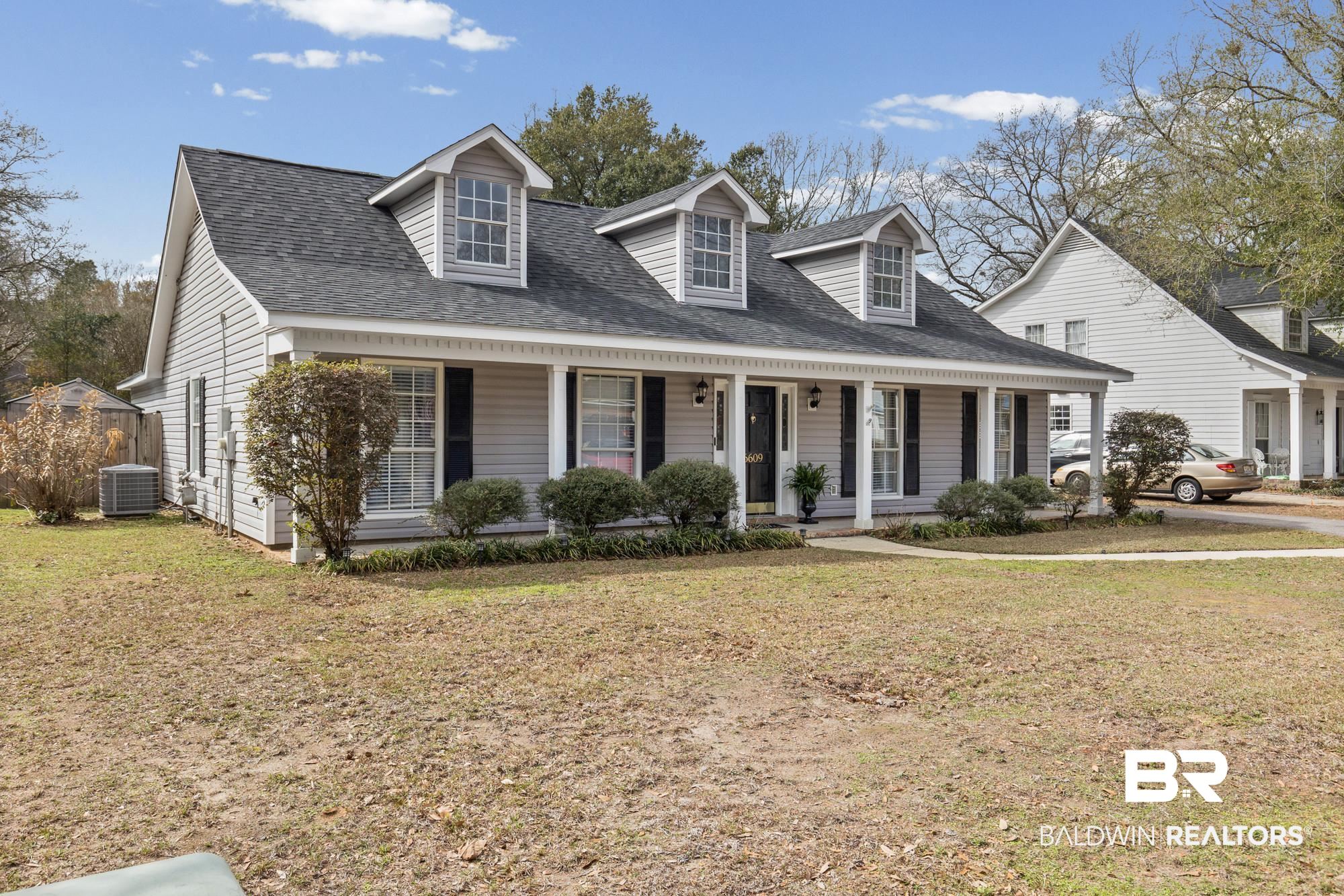 6609 Blakeley Court Mobile, AL 36695 - Photo 1 of 28 Cape cod home with a porch, roof with shingles, and a front yard