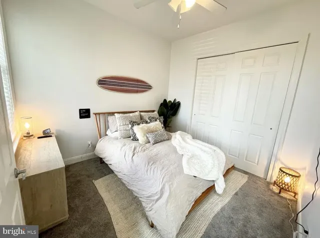 a bedroom with a bed and a mirror