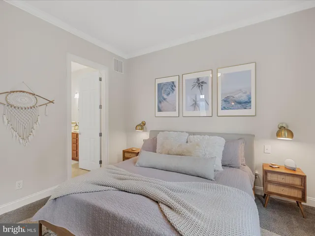 a bedroom with a bed and a couch