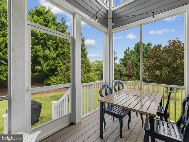 a view of balcony with furniture and wooden deck