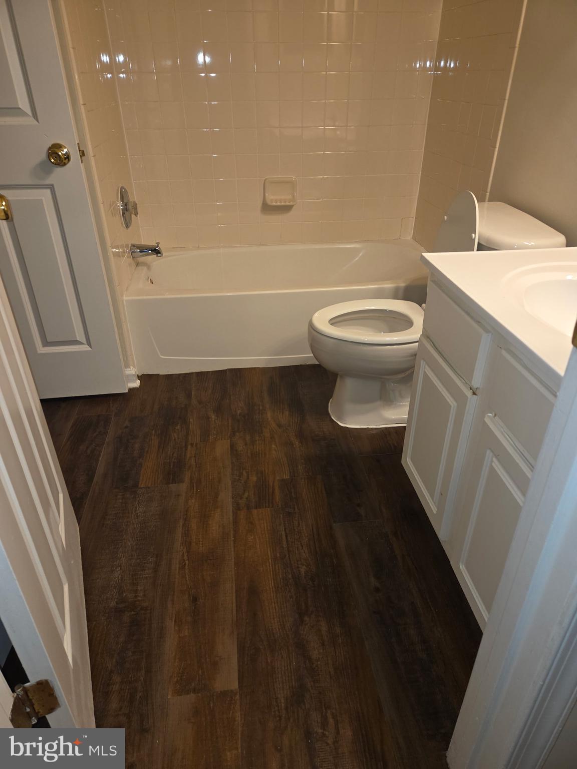 146 Danbury Street Southwest Washington, DC 20032 - Photo 12 of 40 a bathroom with a toilet a sink and bathtub